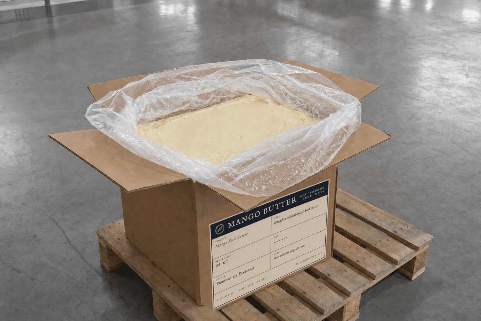 An opened 25 kg Mango Butter carton with its food-grade liner folded back to show solid pale mango butter